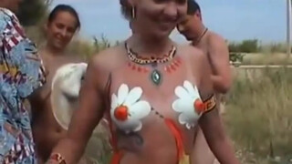 10. Nudists getting body painted (quite a few have bush!)