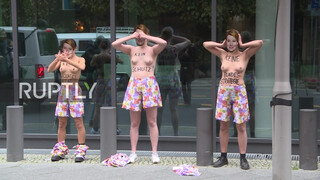 9. Fashion tip for the topless protest: wear pajama bottoms!