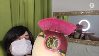 9. A very interesting pillow, made to look like a wrapped up piece of chocolate. Oh, and something in the background.