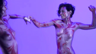 7. Two models in body paint caress each other at 0:05 in “LOVE is LOVE…Body Painting Teri & Shanna”