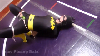 5. Batgirl is tied up and strapped to a vibrator in “Recent Bondage Latek Girl Orgasm On Catsuit”