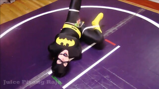 6. Batgirl is tied up and strapped to a vibrator in “Recent Bondage Latek Girl Orgasm On Catsuit”
