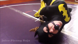 9. Batgirl is tied up and strapped to a vibrator in “Recent Bondage Latek Girl Orgasm On Catsuit”