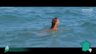 French woman skinny dipping in ocean