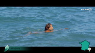 6. French woman skinny dipping in ocean