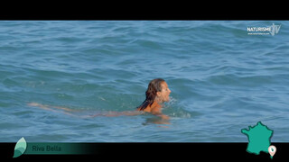 7. French woman skinny dipping in ocean