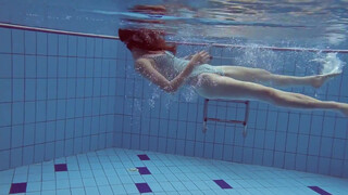 7. swimming girl under water, flashes on time stamp and at 55 seconds