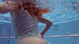2. swimming girl under water, flashes on time stamp and at 55 seconds