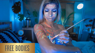 6. Body painter shows us her pussy at 6:42 in reupload of “Bodypaint Professional – Glowing Tribal Markings”
