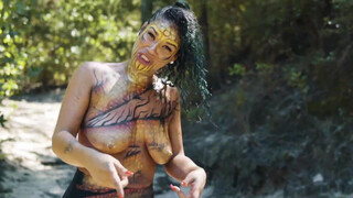 4. topless body painted singer
