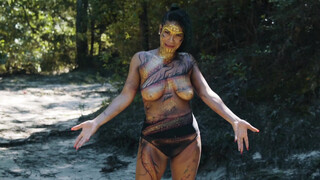 1. topless body painted singer