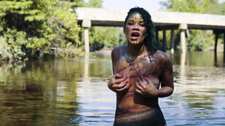 10. topless body painted singer