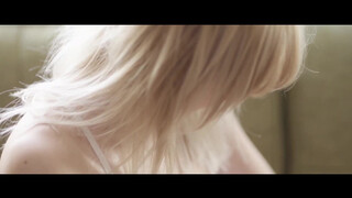 2. Taking off a see-through bra at 3:25 in “Danielle Sharp | May Contain Girl Photoshoot video”
