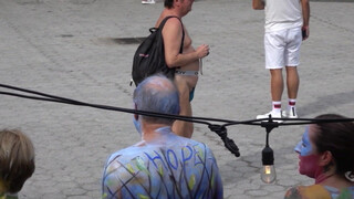 Thin bodypainted girl shows off her naked body in public