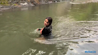 6. Wetlook girl get wet in mountain stream in skirt and tights
