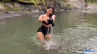 8. Wetlook girl get wet in mountain stream in skirt and tights