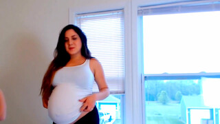 4. Pregnant woman milking herself with an pump