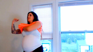 1. Pregnant woman milking herself with an pump