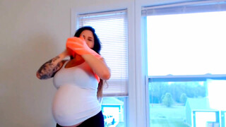 2. Pregnant woman milking herself with an pump