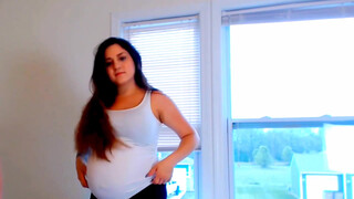 3. Pregnant woman milking herself with an pump