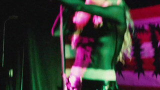 The singer in a transparent shirt.