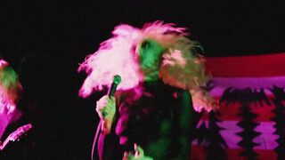 7. The singer in a transparent shirt.