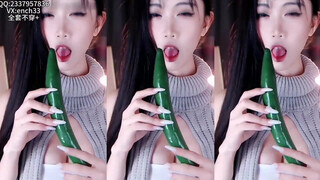 6. A Chinese girl dances licking a cucumber.