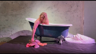 Voluptious performance artist disrobing (0:36)