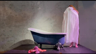 3. Voluptious performance artist disrobing (0:36)