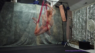 8. Nude woman suspended in rope!