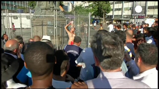 8. Chained naked to a fence, woman protests against sexism in Brazil
