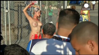 9. Chained naked to a fence, woman protests against sexism in Brazil