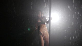 7. Naked pole dancer getting wet