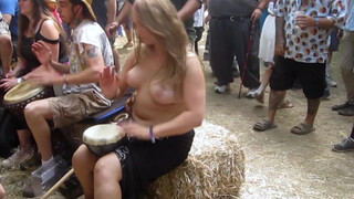 9. Beating the Bongo and Bouncy Breasts. Drum circle with topless hippy drummer free spirit