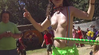 7. Topless Cowgirl Hippy with Lime Green Hula Hoop and Rave Skirt Enjoying the Sunny Day at a Festival