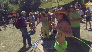 8. Topless Cowgirl Hippy with Lime Green Hula Hoop and Rave Skirt Enjoying the Sunny Day at a Festival