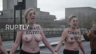 Sure looks chilly : UK: Topless climate activists block London bridge with human chain on IWD *EXPLICIT*