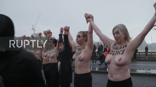 6. Sure looks chilly : UK: Topless climate activists block London bridge with human chain on IWD *EXPLICIT*
