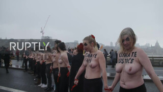 7. Sure looks chilly : UK: Topless climate activists block London bridge with human chain on IWD *EXPLICIT*