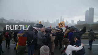 8. Sure looks chilly : UK: Topless climate activists block London bridge with human chain on IWD *EXPLICIT*