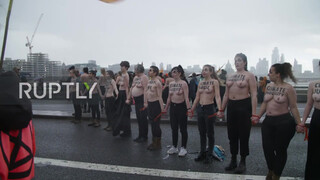 2. Sure looks chilly : UK: Topless climate activists block London bridge with human chain on IWD *EXPLICIT*