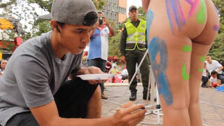7. Nude woman gets painted in public