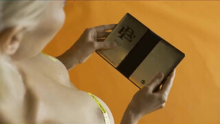 5. Pablo Escobar's brother made a foldable phone.. and advertises it with tits.
