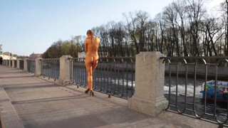 8. Topless Golden Girl Posing Outside