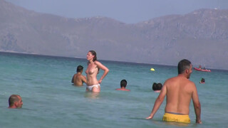 4. Topless Frisbee beach girl
