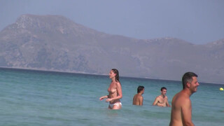 8. Topless Frisbee beach girl