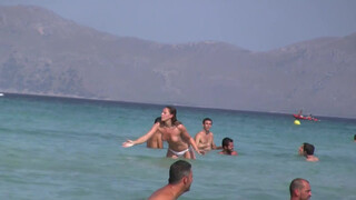 9. Topless Frisbee beach girl