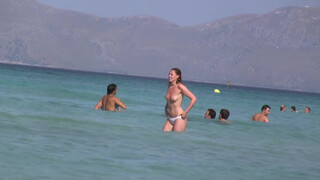 2. Topless Frisbee beach girl