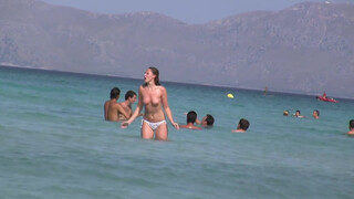 3. Topless Frisbee beach girl
