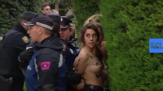 9. Topless protesters assaulted in Spain